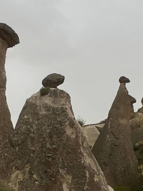       Rock formation with a balancing rock on top.
  