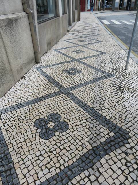       Tiled pavement with a repeating pattern.
  