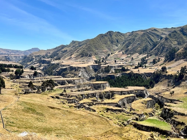       Expansive view of rugged terrain with hills.
  