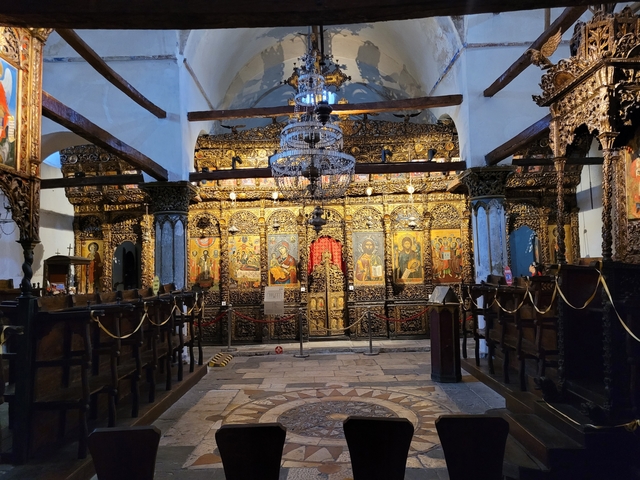 Ornate interior of a historical church with golden decorations.