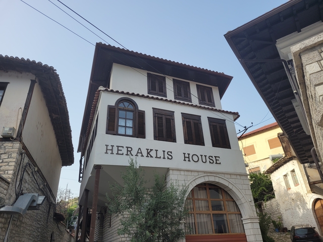 Heraklis House, a building with traditional architecture.