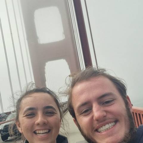       Selfie with a partial view of the Golden Gate Bridge.
  