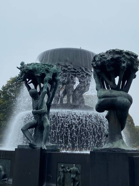 A sculptural fountain with cascading water.