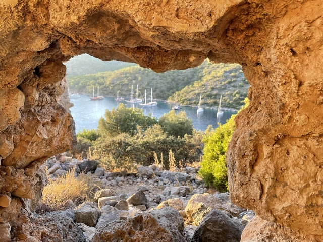 View of a bay through a natural rock window.