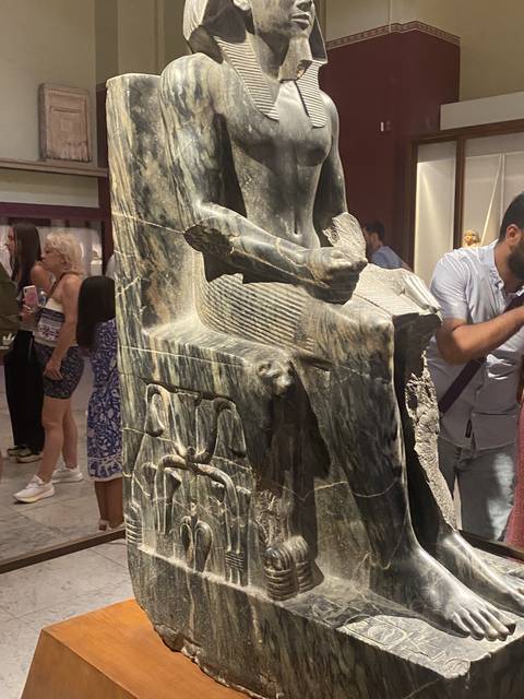 Ancient statue on display in a museum.