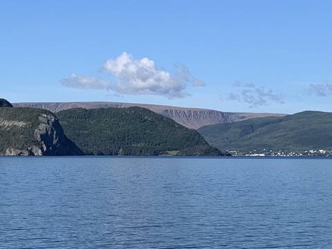 View of a mountain range by the water.