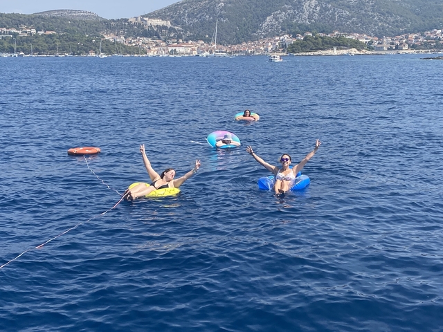 People floating in the sea on inflatable tubes.