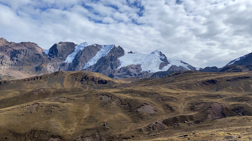 Snow-capped mountains with a clear blue sky.