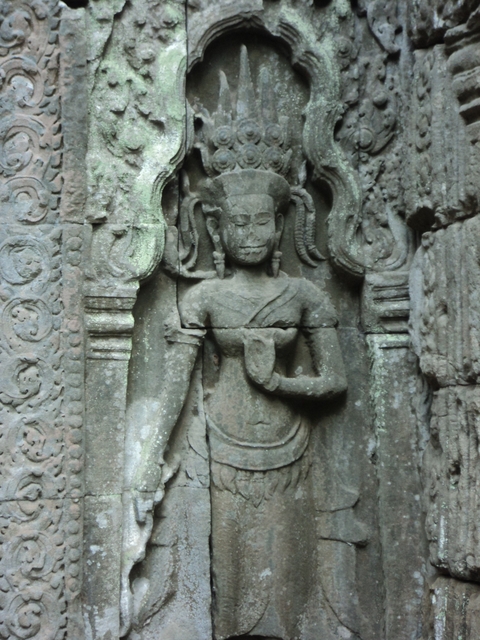       Ancient stone carving of a figure.
  