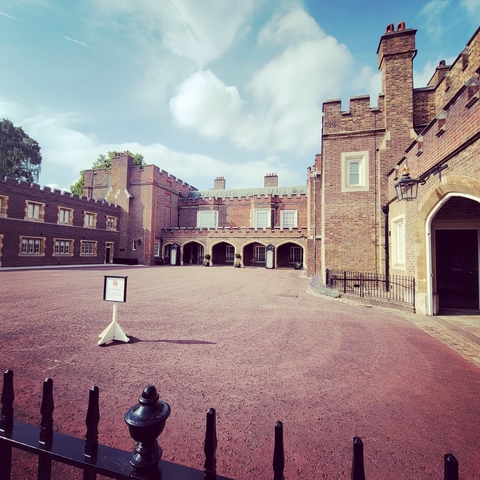       Historic building with a cobblestone path.
  