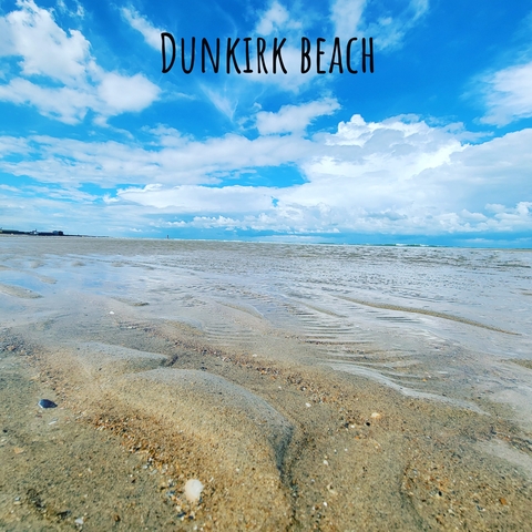 Shoreline with shallow water and sandy beach.