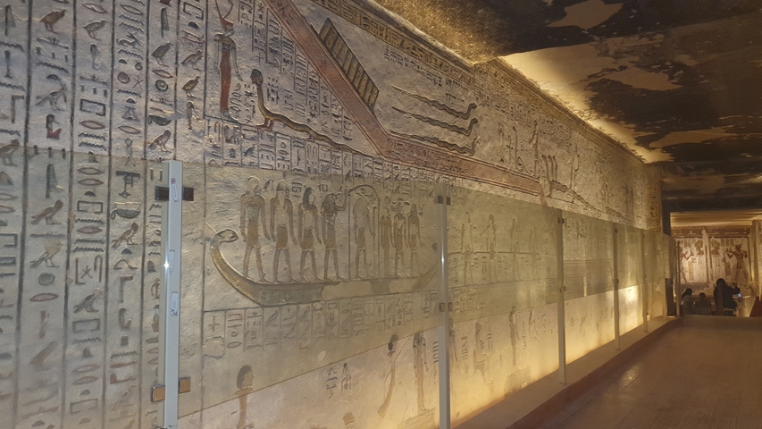 Ancient hieroglyphs decorated wall in a historic site.