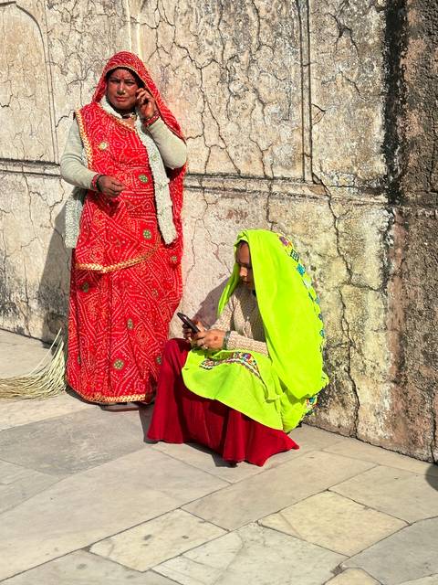       People in colorful traditional attire.
  