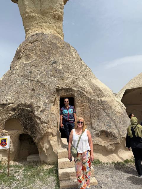 Visitors exploring rock formations and caves.