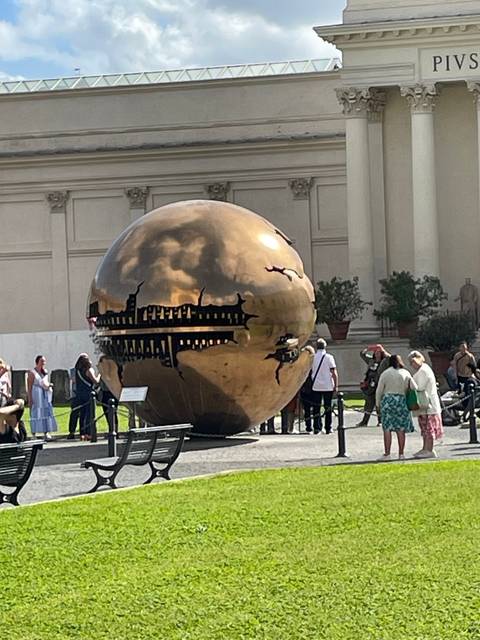 Sphere sculpture in a garden area