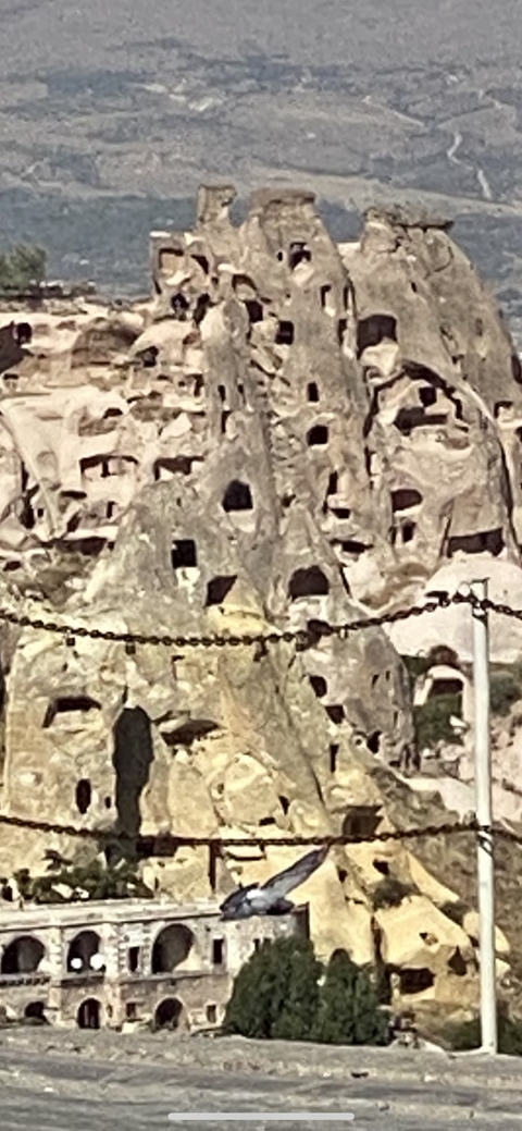 Rock formations with rectangular openings.