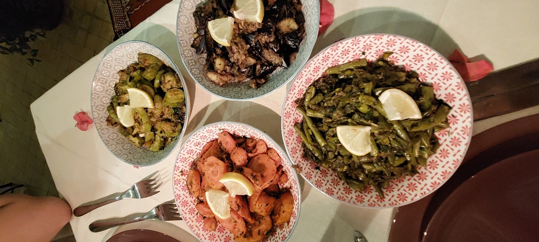       Moroccan food dishes with a variety of vegetables.
  