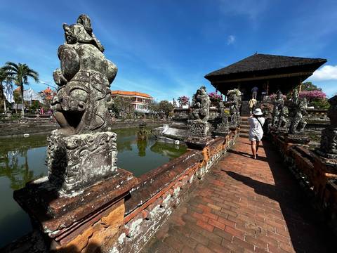 Upside-down image of temple grounds with statues.