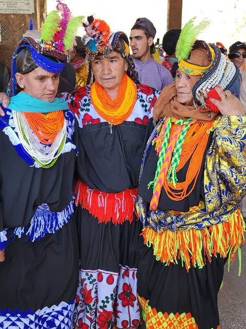       People in colorful traditional attire.
  