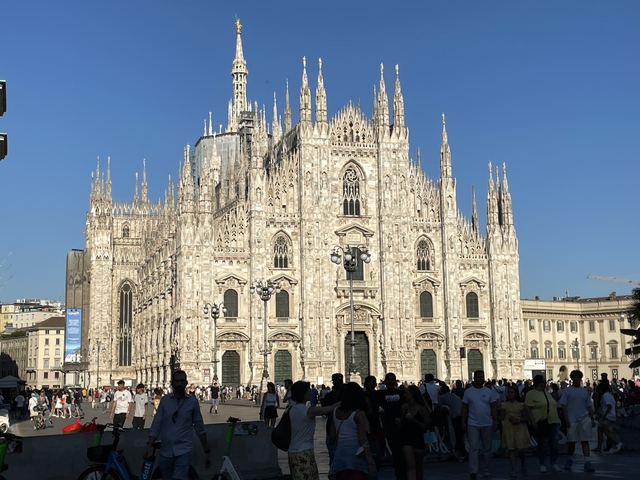 View of the Milan Cathedral with people in the foreground.