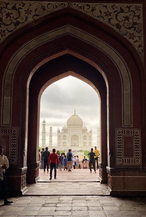 Taj Mahal framed through an archway.
