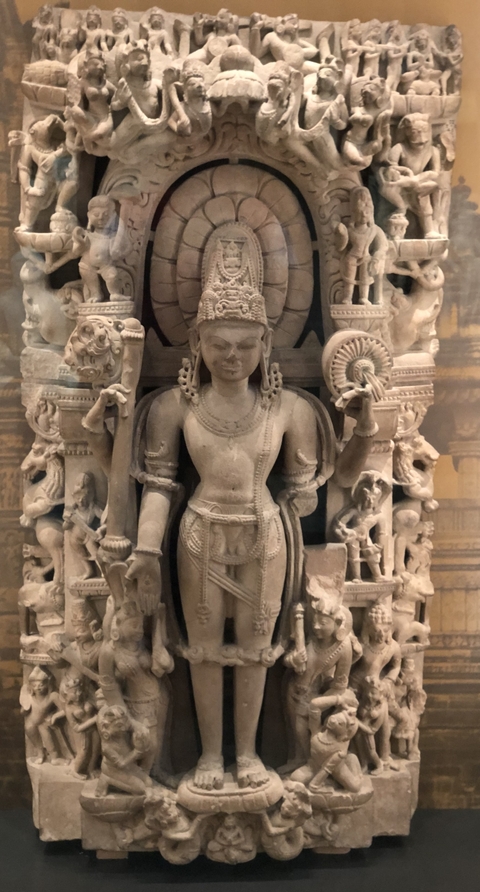       Historical stone statue in a museum exhibit.
  