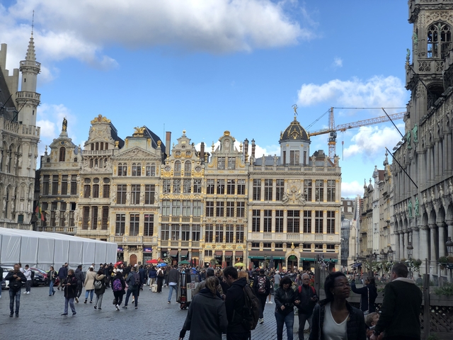 Grand place with ornate buildings.