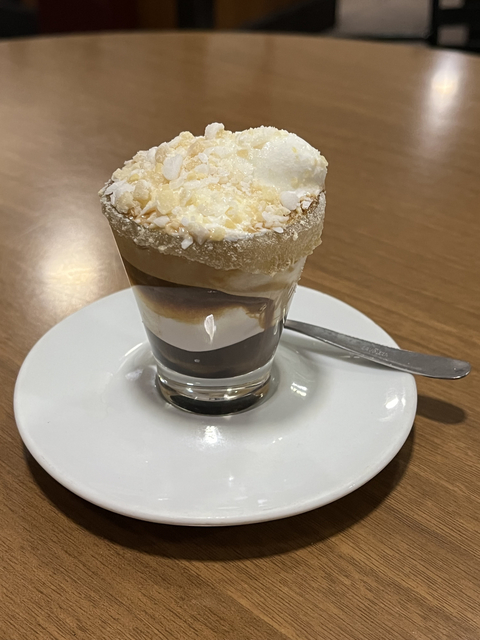 Close-up of a layered dessert in a glass.