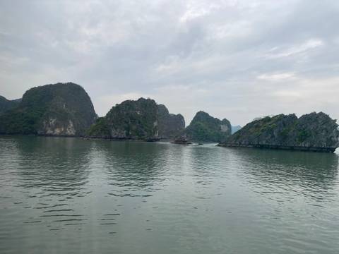 Inverted view of limestone hills reflecting on water.
