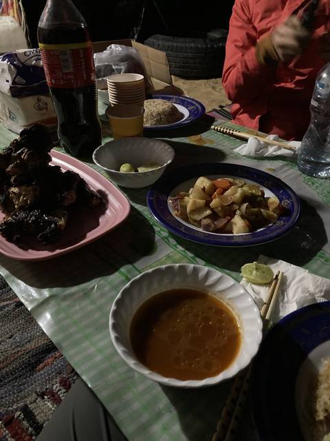 Dinner spread with various traditional dishes.