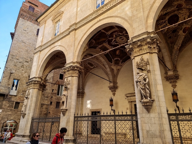 Monumental columns and arches with intricate designs.