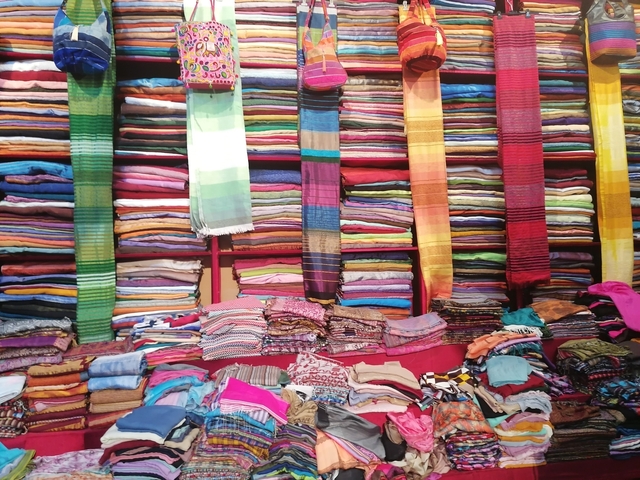       Showcase of colorful textiles and fabrics.
  