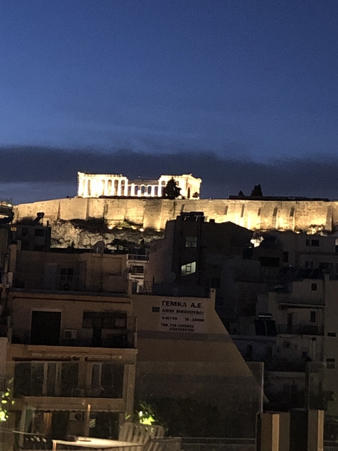 View of the Acropolis lit up at night.