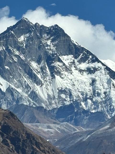       Close-up view of a snow-covered mountain peak.
  