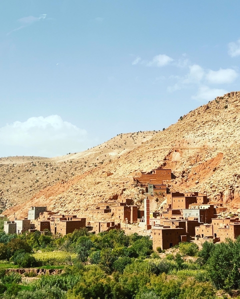 Cluster of traditional buildings on a hillside.