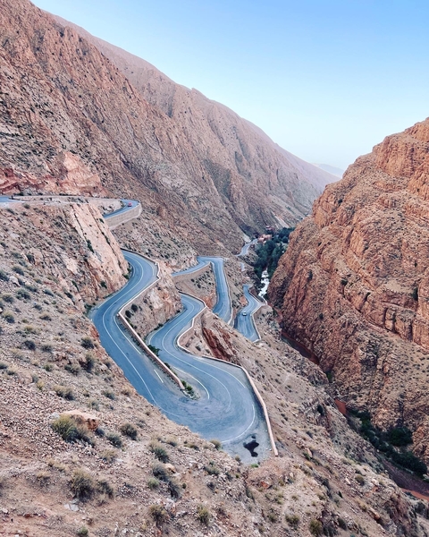 Curvy mountain road in a rocky landscape.