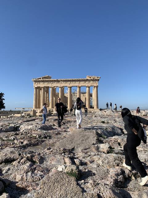Ancient ruins with tourists.