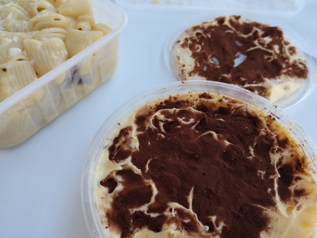 Close-up of desserts, possibly tiramisu and some cookies.
