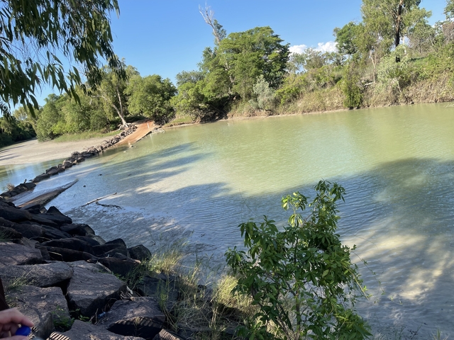 River with surrounding greenery and rocks.