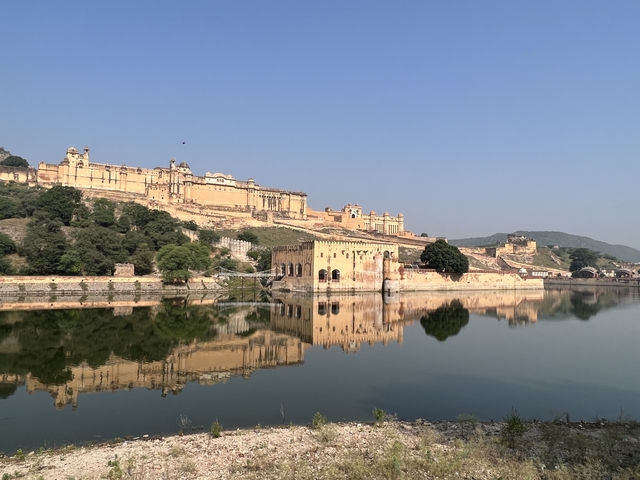 Historic fort reflecting in a calm lake.