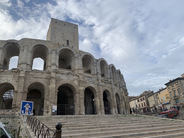 Exterior view of a large historic coliseum.