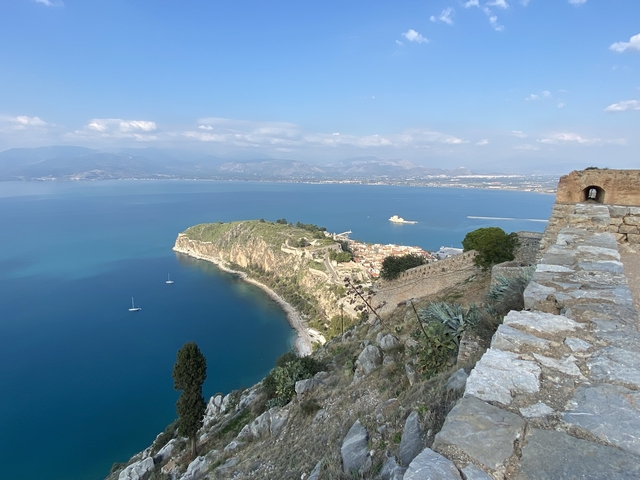       Promontory with a historic town and coastline.
  