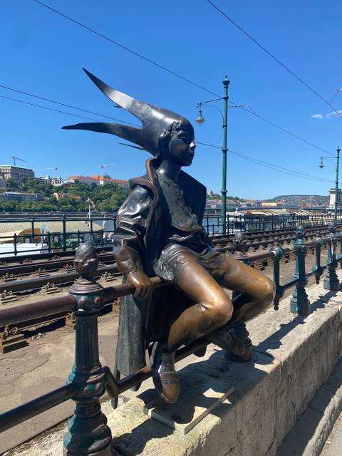       Bronze statue on the riverside.
  