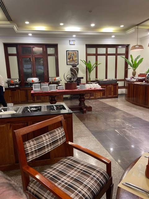       Indoor dining area with table settings.
  