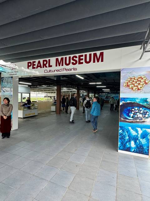       Museum entrance with people.
  