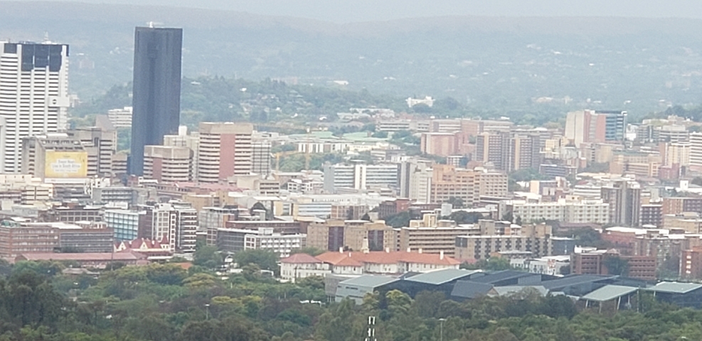 Panoramic view of a cityscape with urban buildings.