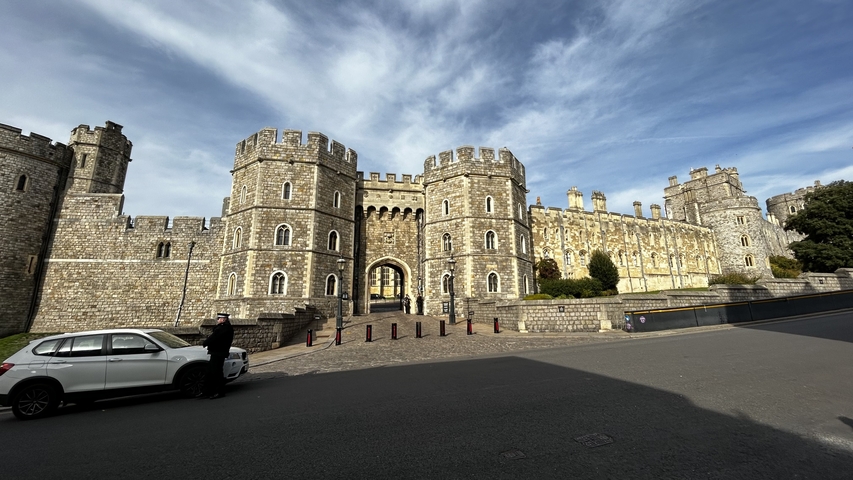       Windsor Castle with a partly cloudy sky.
  