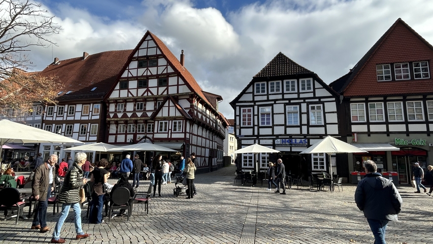       Town square with traditional half-timbered houses.
  