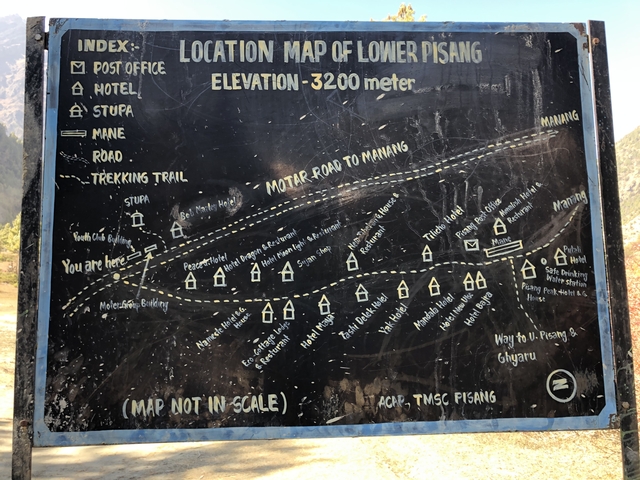 Map sign indicating local trails and sites.