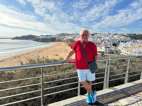 Person upside-down with a beach setting.